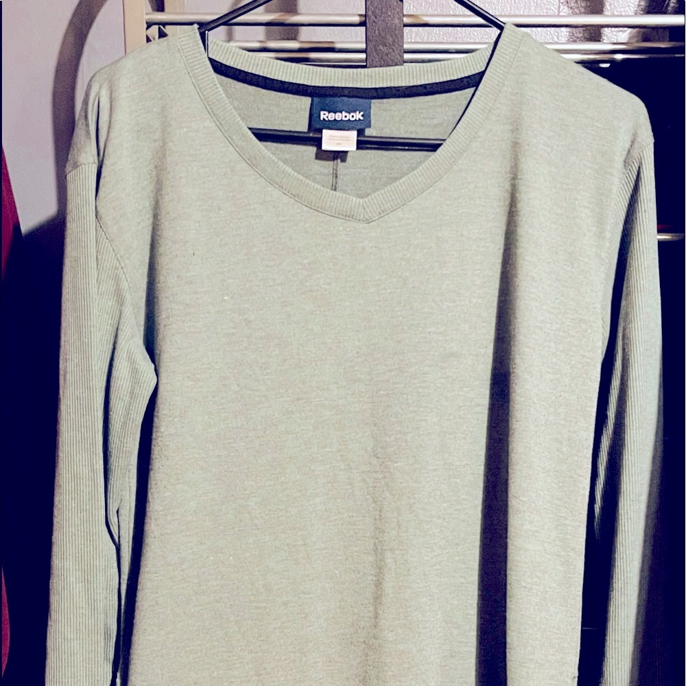 Woman’s medium Reebok sweatshirt. Light green in color, lightly worn.